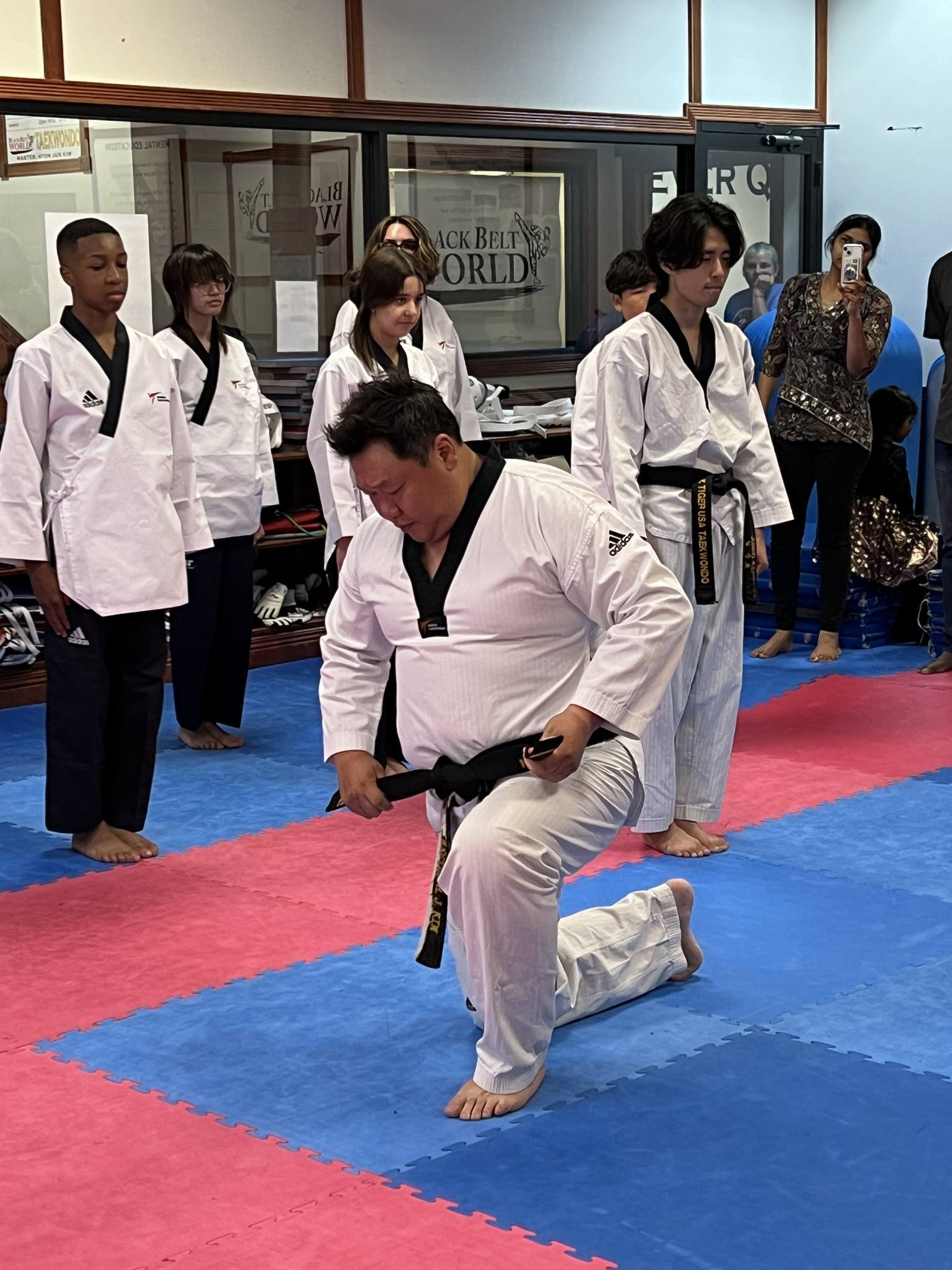 Instructor guiding students through techniques